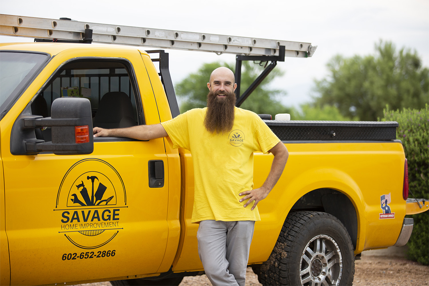 Brandon Savage next to work truck